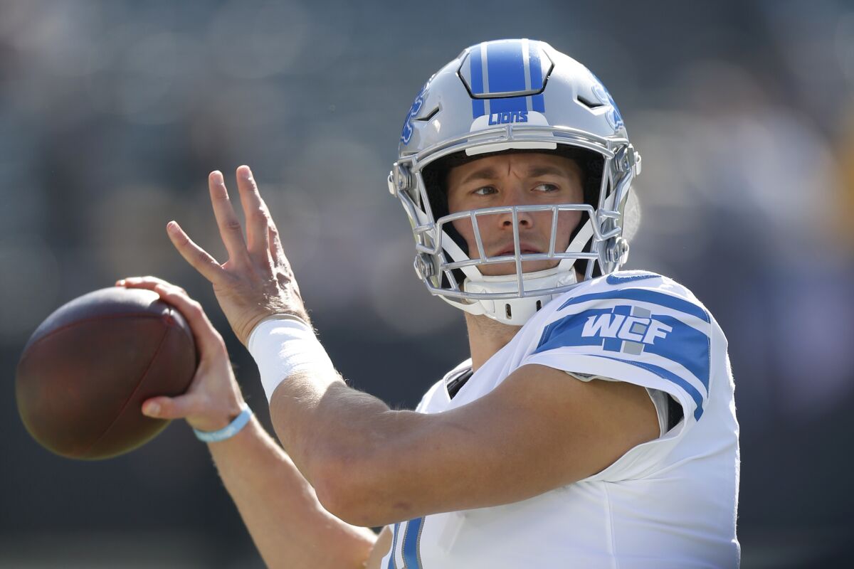 FILE - In this Nov. 3, 2019, file photo, Detroit Lions quarterback Matthew Stafford warms up before an NFL football game against the Oakland Raiders in Oakland, Calif. Since the start of last year, Matthew Stafford has had to deal with a health scare involving his wife, his own injury problems -- and more recently, a coronavirus test that the team later described as a false positive. It's been a difficult period for the Detroit star. (AP Photo/D. Ross Cameron, File)