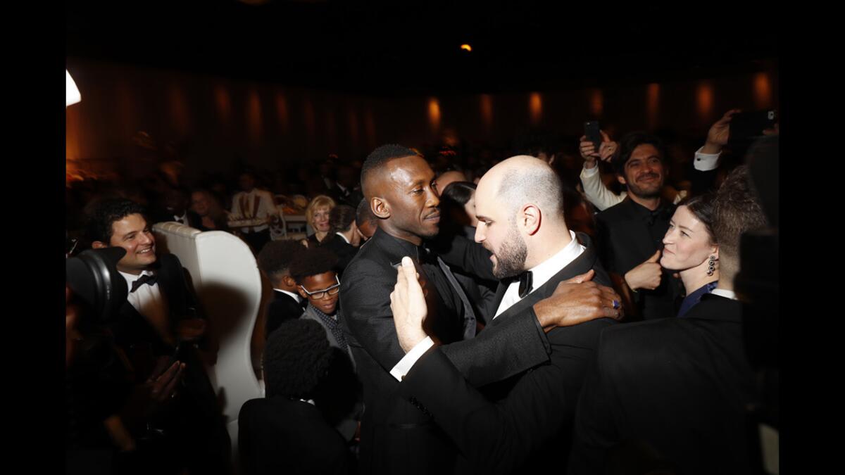 "Moonlight" actor Mahershala Ali and "La La Land" producer Jordan Horowitz embrace after the Oscars. (Jay L. Clendenin / Los Angeles Times)