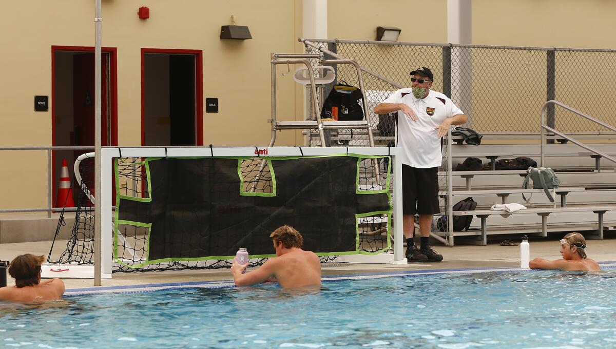 Coach Matt Frazier and the Estancia High School boys' water polo team won their season opener Tuesday.