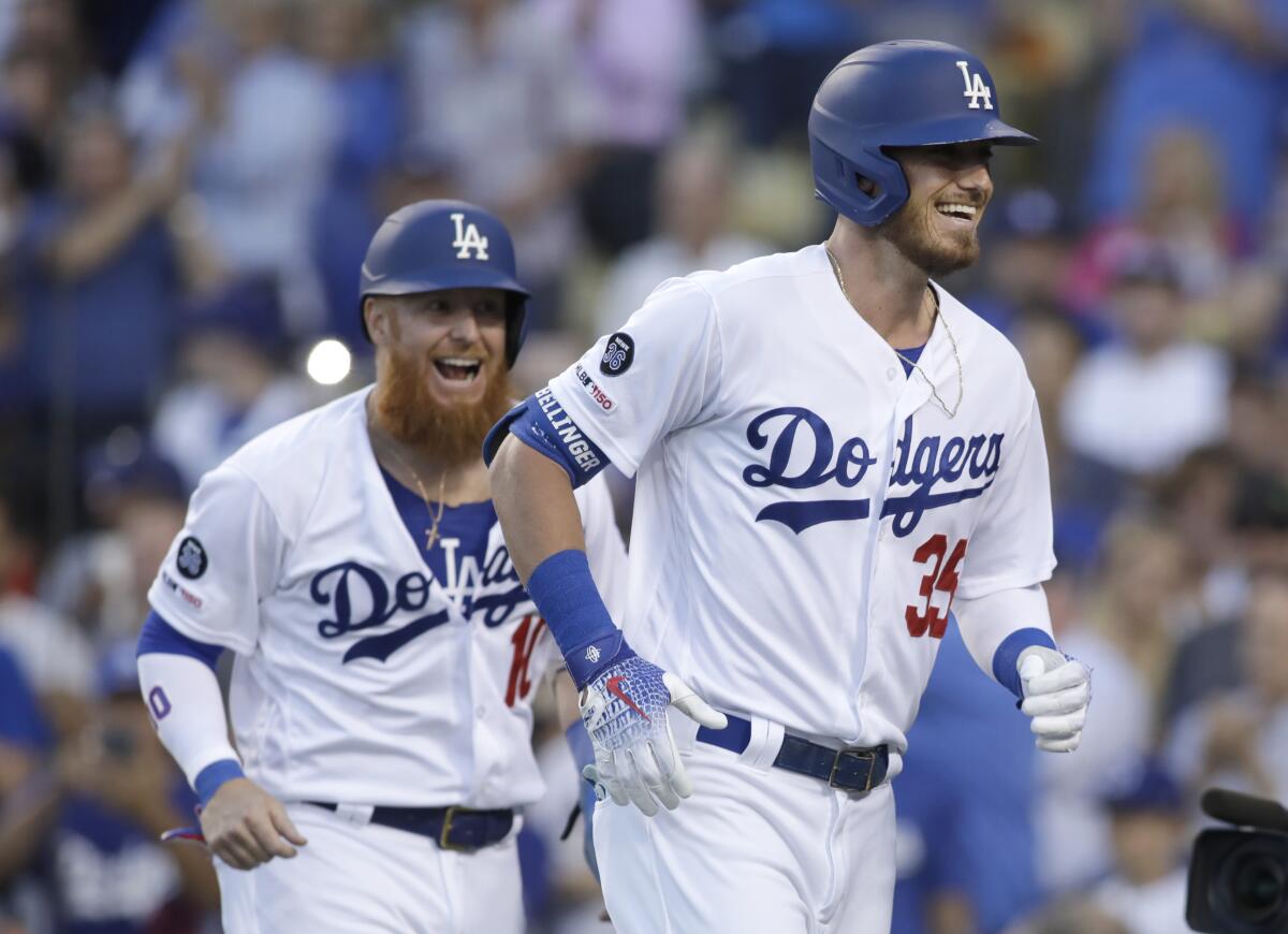 Cody Bellinger, right, celebrates with teammate Justin Turner.