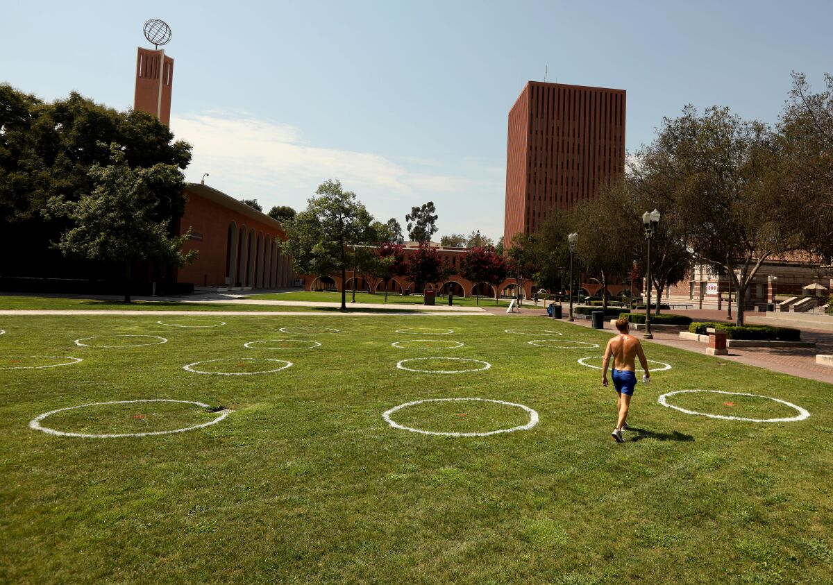 USC student David Appelbaum, 22, walks through a nearly empty campus on Monday.