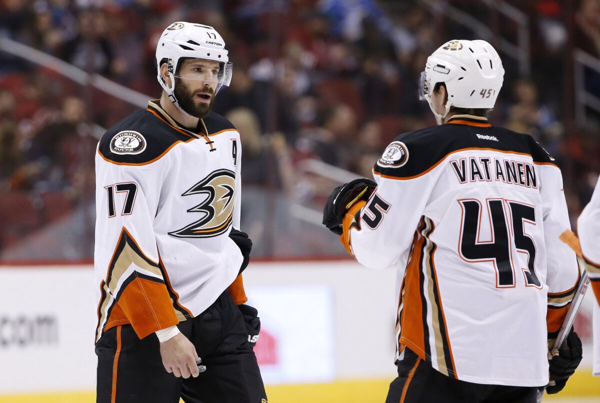 Ducks forward Ryan Kesler (17) talks with defenseman Sami Vatanen (45) during the second period of a game against the Arizona Coyotes on March 3.