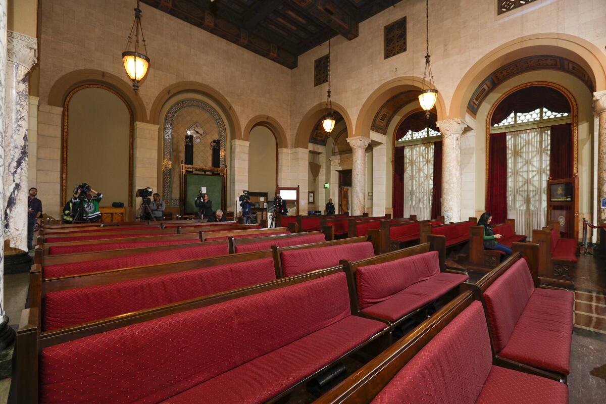 The Los Angeles City Council chamber is shown during a meeting on March 17, when the public was told to gather in a tent outside and watch the proceedings on video.