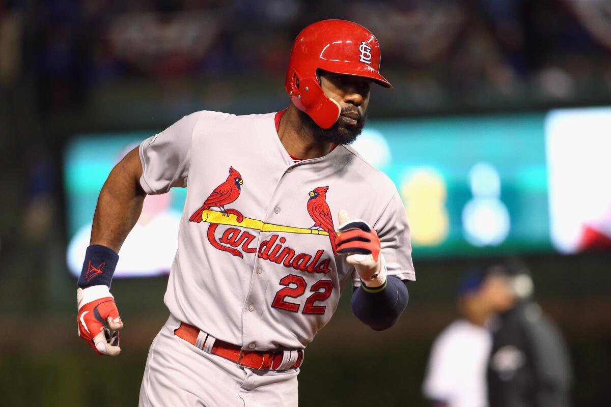 Cardinals outfielder Jason Heyward circles the bases after hitting a two-run homer against the Cubs in the playoffs. Heyward reportedly agreed to sign with the Cubs on Friday.