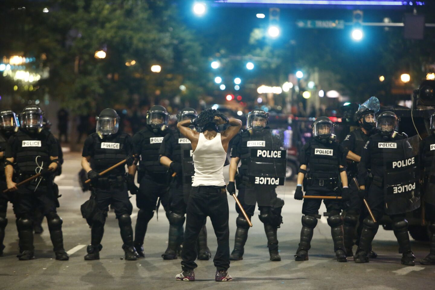 A protester faces off with riot police on Wednesday.