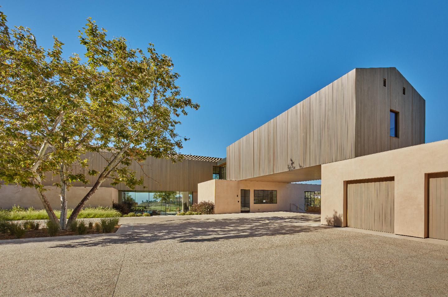 The modern mansion, built in 2021 by Noah Walker, holds 19,000-square-foot of spaces filled with glass, wood and stone.