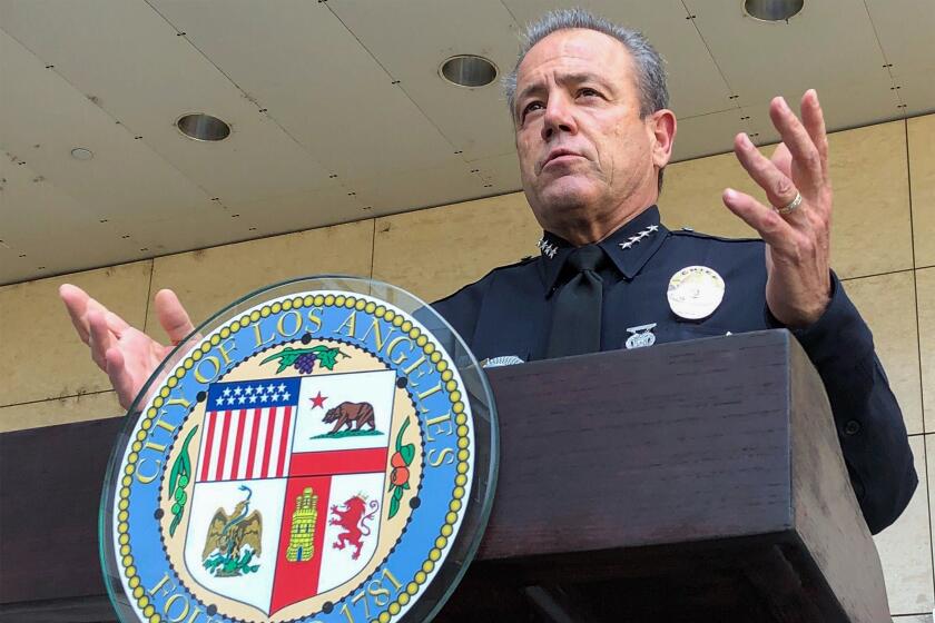 Aug. 26, 2020, file photo, Los Angeles Police Chief Michel Moore speaks during a news conference outside LAPD headquarters. 