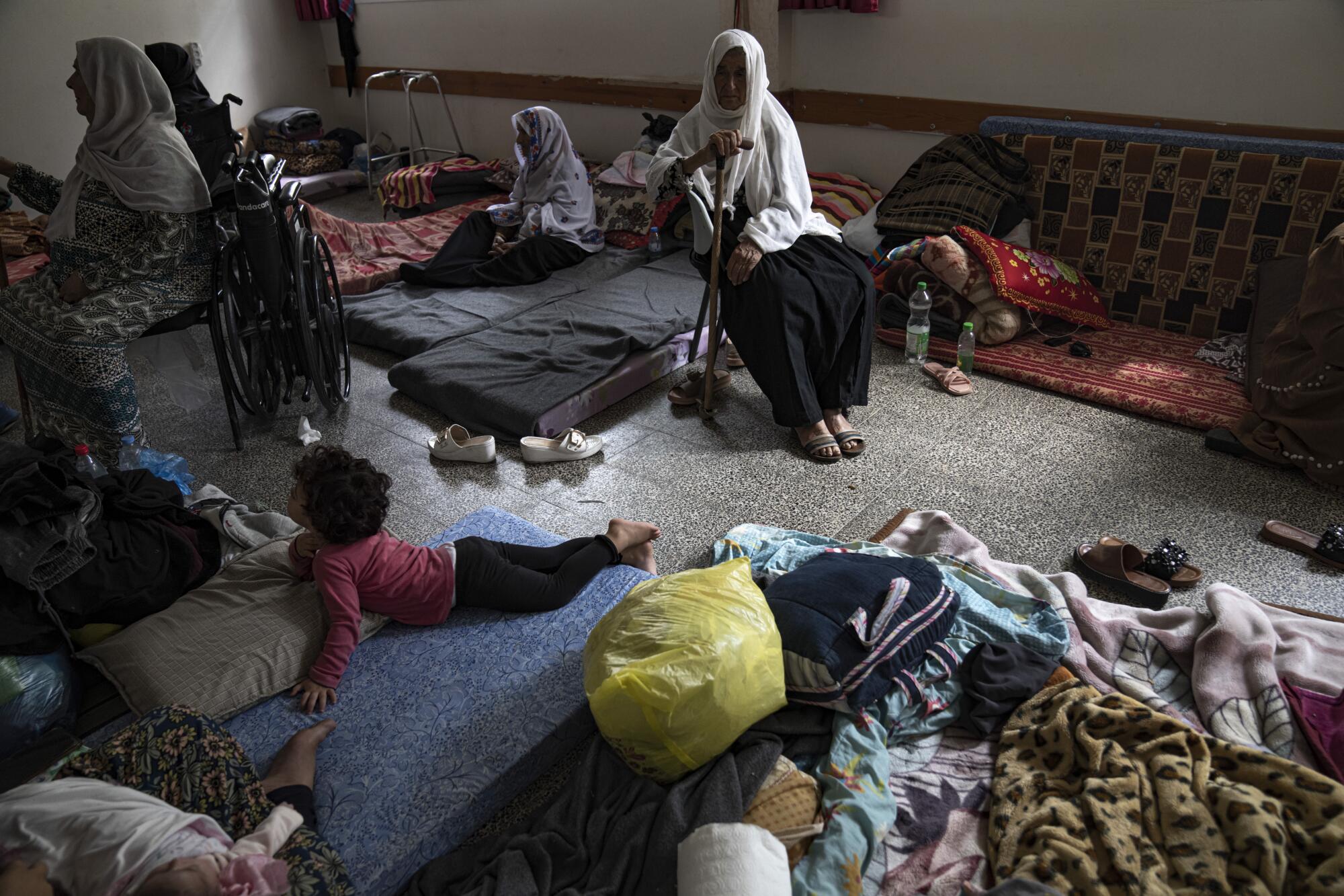 Palestinians take shelter from Israeli bombardment at a school in the Gaza Strip