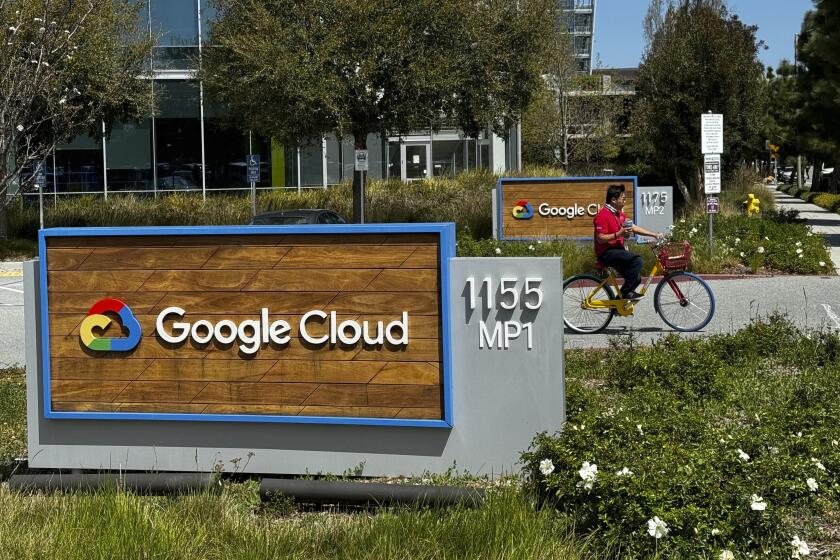 A person rides past the Google sign outside the Google offices in Sunnyvale, Calif., on Thursday, April 18, 2024. Google has fired 28 employees who were involved in protests over the tech company’s cloud computing contract with the Israeli government. The workers held sit-ins at the company’s offices in California and New York over Google’s $1.2 billion contract to provide custom tools for Israeli’s military. (AP Photo/Terry Chea)