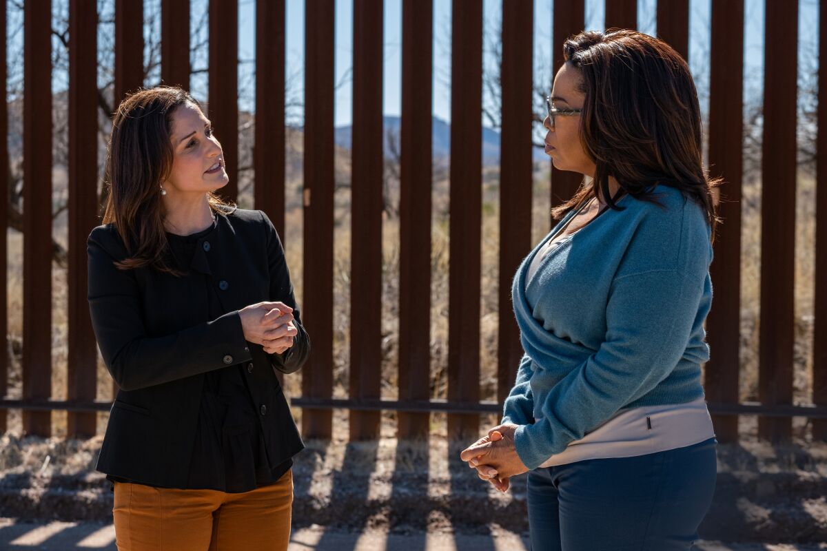 Luz Maria Garcini, left, and Oprah Winfrey at the U.S.-Mexico border in part two of the upcoming "Oprah's Book Club" episode.