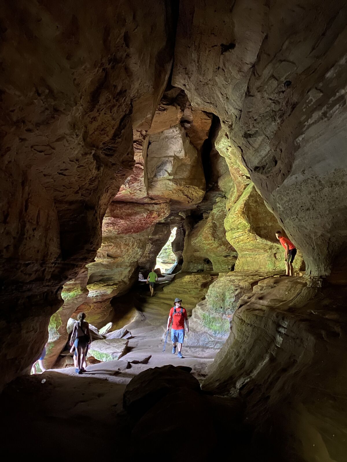 Visitors walk through Rock House, a cave in Hocking Hills State Park with a 200-foot corridor and 25-foot-high ceilings. 