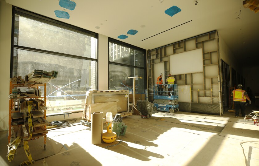 Sunlight fills a gathering area off the lobby of the CitizenM hotel.