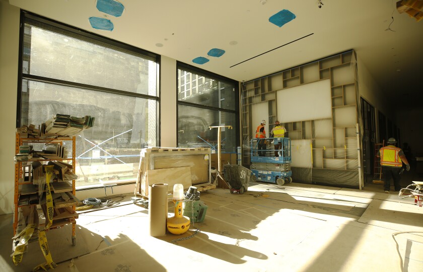 Sunlight fills a gathering area off the lobby of the CitizenM hotel. 