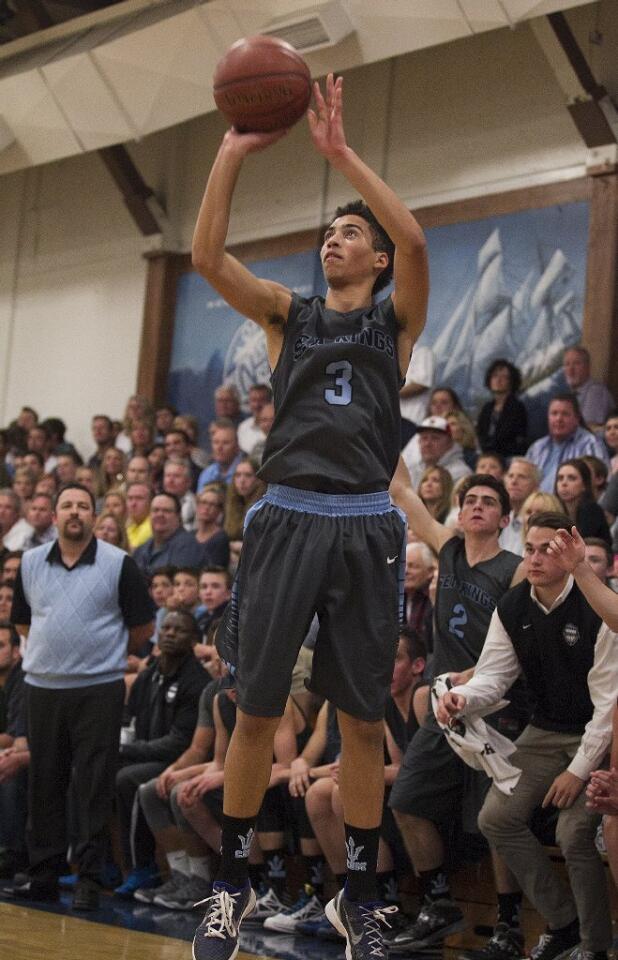 Corona del Mar High's Sam Kobrine shoots a three-point shot during the Battle of the Bay against Newport Harbor on Saturday.