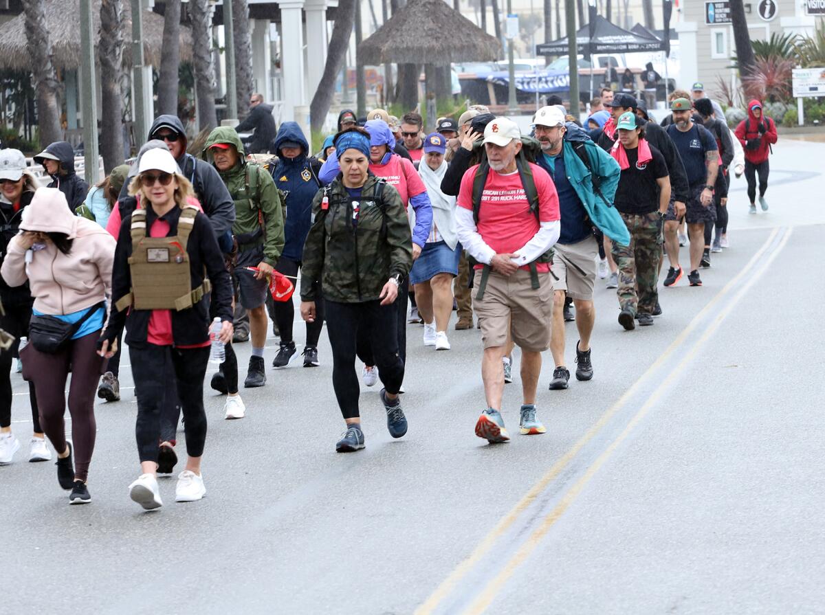 About 100 people take part in the ruck march. 