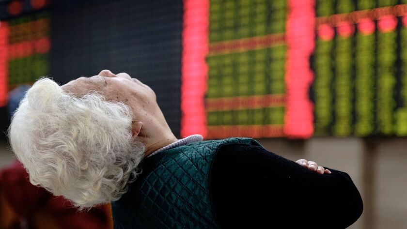 The scene at a brokerage house in Shanghai, China. China's Shenzhen stock market entered bear-market territory this week.