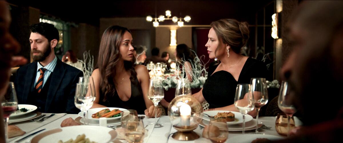 Zoe Saldana as Rita Moro Castro and Karla Sofía Gascón as Emilia Perez in 'Emilia Perez'