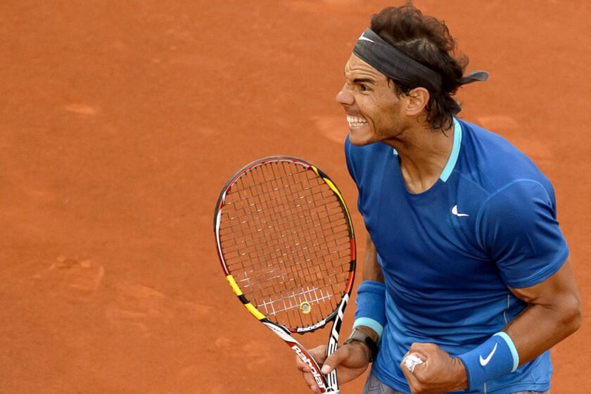 Rafael Nadal celebrates after winning a point against Kei Nishikori in the championship match at the Madrid Open on Sunday.