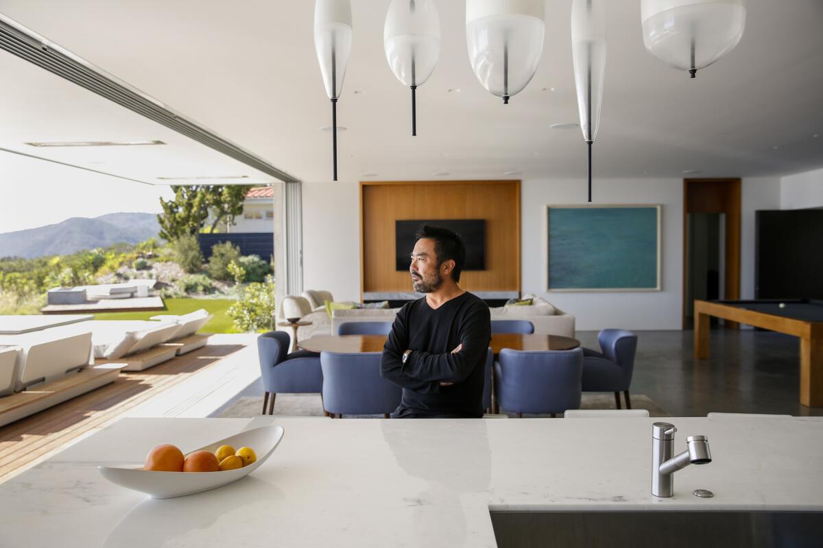 Takashi Yanai, FAIA design director of the residential studio at the firm Ehrlich Yanai Rhee Chaney Architects, sits for a portrait inside his recent remodel.