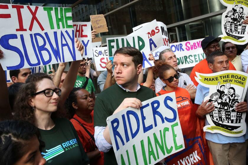 NEW YORK, NEW YORK--JUNE 28, 2017---John Raskin, center, executive director of Riders Alliance, leads a rally of members to demand improvements in public transportation. The declining state of New York public transportation led to a protest/press conference on June 28, 2017 calling on Governor Cuomo to do more to improve NY transportation. (Carolyn Cole/Los Angeles Times)