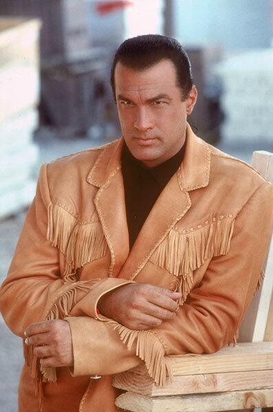 Ponytailed aikido machine Steven Seagal got his on-screen break after years of training and teaching in Japan. This is the only bad-ass we know that can twist your arm out of its socket, then play you a New World version of American Pie on his guitar.