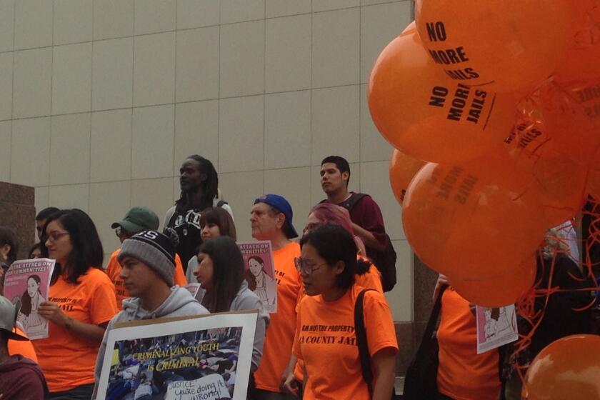 Protesters gather outside the Los Angeles County Hall of Administration to oppose plans to rebuild the Men's Central Jail.