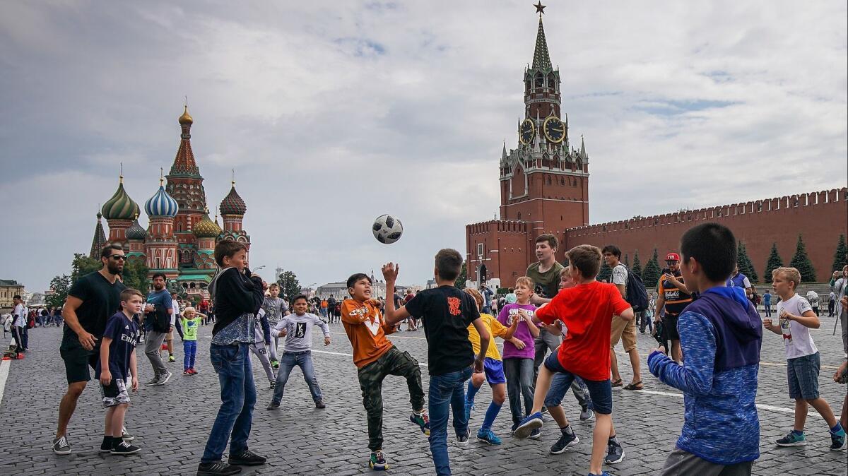 Young fans from across the world play soccer in Moscow's Red Square.