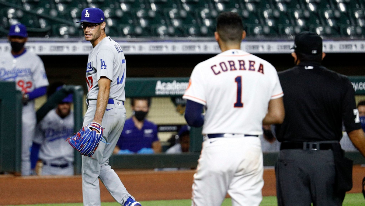 Dodgers pitcher Joe Kelly, left, exchanges words with Houston Astros shortstop Carlos Correa.