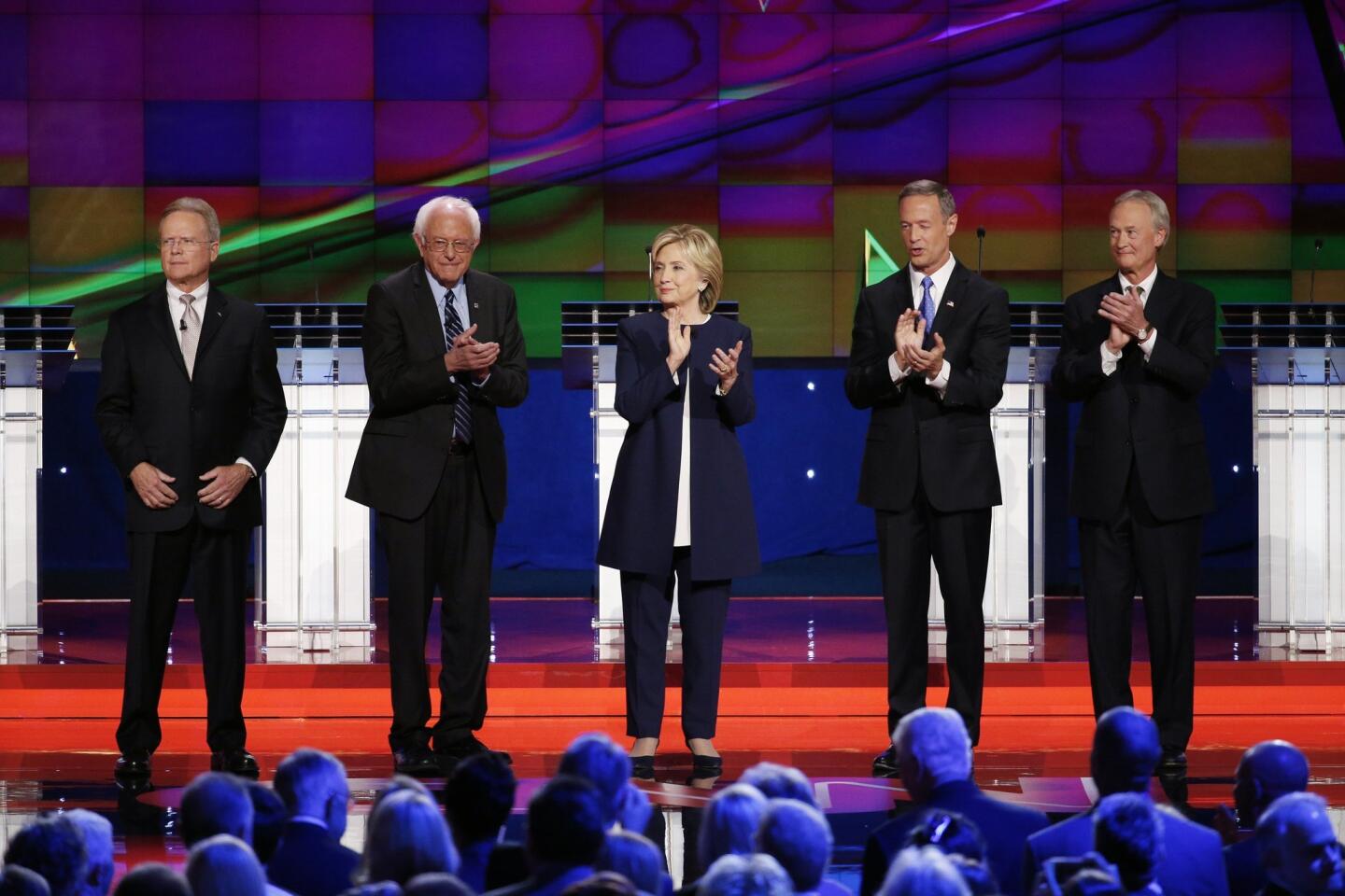 Democratic presidential candidates from left, former Virginia Sen. Jim Webb, Sen. Bernie Sanders, of Vermont, Hillary Rodham Clinton, former Maryland Gov. Martin O'Malley, and former Rhode Island Gov. Lincoln Chafee take the stage before the CNN Democratic presidential debate in Las Vegas.