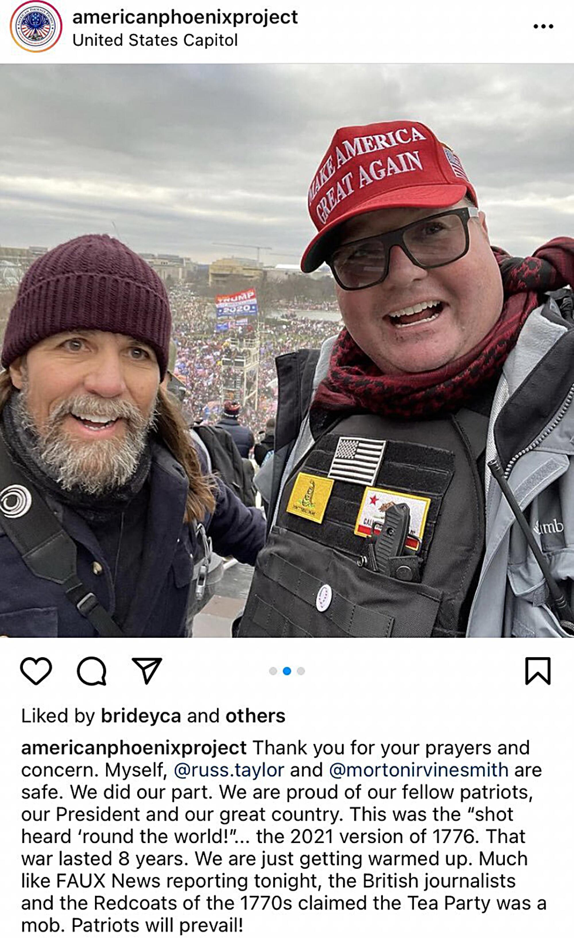 Two men in a selfie taken in front of a massive mob outside the U.S. Capitol building