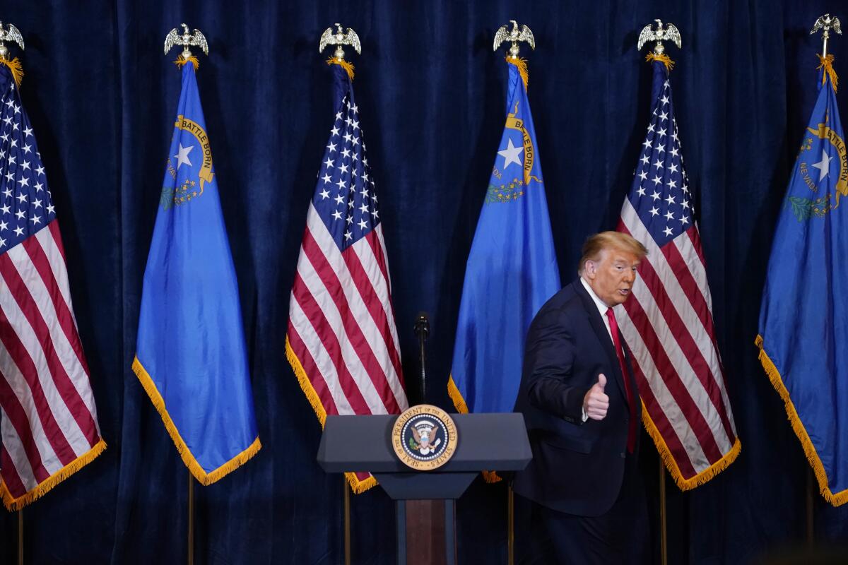 President Trump walks off after speaking to the media at Trump International Hotel Las Vegas on Wednesday.