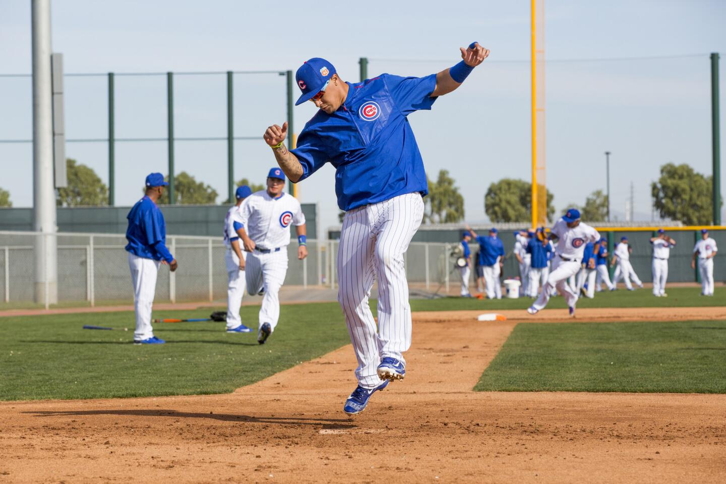 Javier Baez jumps in the air while crossing home plate during spring training at Sloan Park on Monday, Feb. 29, 2016, in Mesa, Ariz.