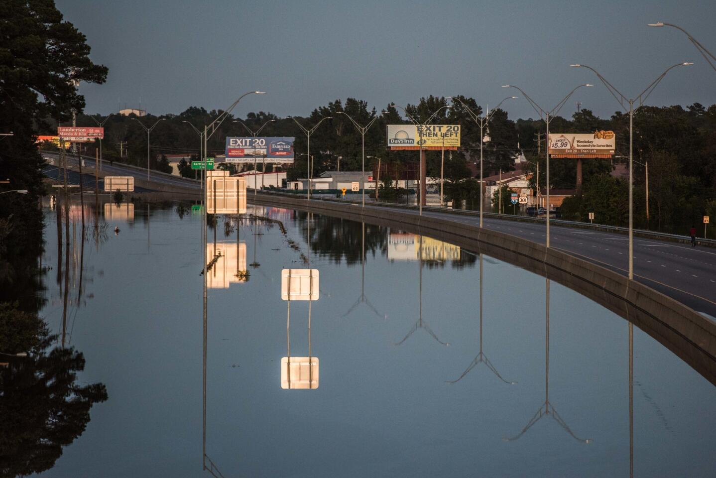 LUMBERTON, NC - OCTOBER 10: Floodwaters block travel on I-95 on October 10, 2016 in Lumberton, North Carolina. The death toll from Hurricane Matthew in the U.S. has climbed to over 20. (Photo by Sean Rayford/Getty Images) ** OUTS - ELSENT, FPG, CM - OUTS * NM, PH, VA if sourced by CT, LA or MoD **