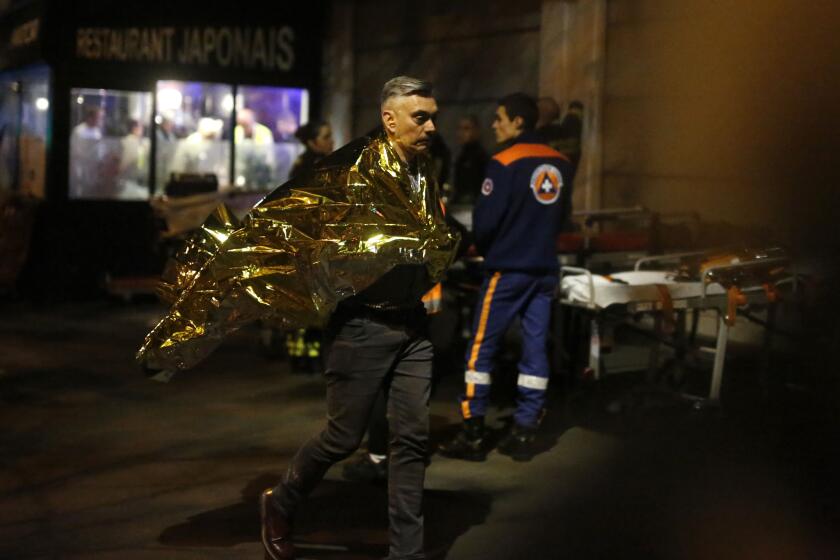 A man walks outside the Bataclan theater in Paris after the terrorist attacks on Nov. 13.