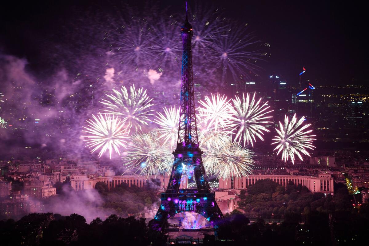 Fireworks illuminate the sky near the Eiffel Tower as part of Bastille Day celebrations in Paris on July 14.