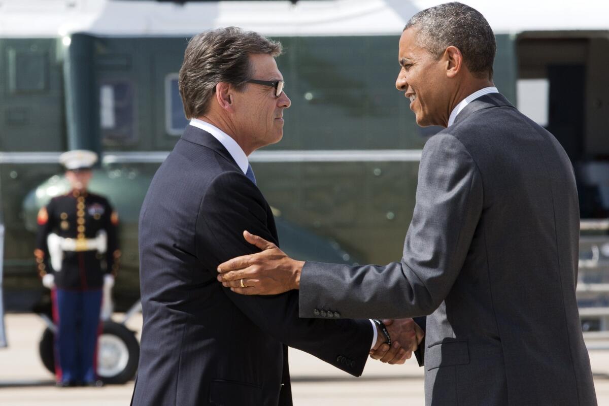 Texas Gov. Rick Perry greets President Obama in Dallas.