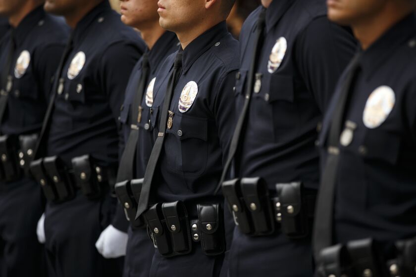 Los Angeles Police Department Recruit Officers from the 12-15 class graduate at the LAPD Parker Center Headquarters on Friday, June 10, 2016 in Los Angeles, Calif. After over 40 years at the LAPD, Earl Paysinger, the highest-ranking black officer who is about to retire. (Patrick T. Fallon/ For The Los Angeles Times)