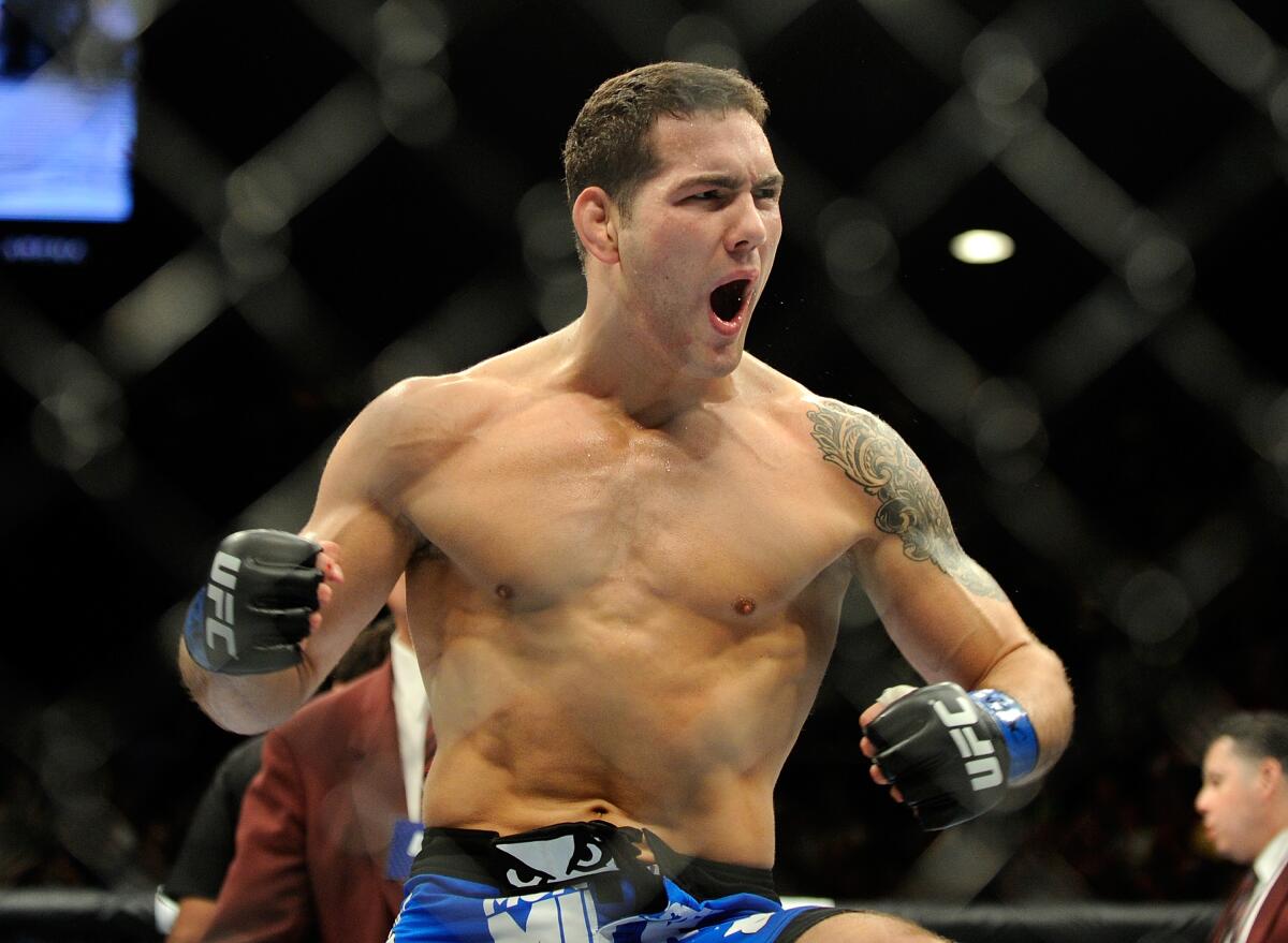 Chris Weidman reacts after knocking down Anderson Silva.