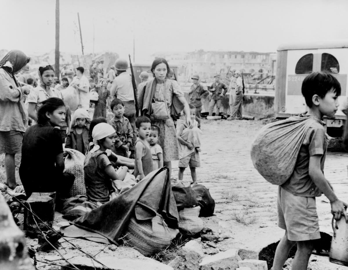Filipino survivors gather after their liberation by U.S. troops on Feb. 23, 1945.