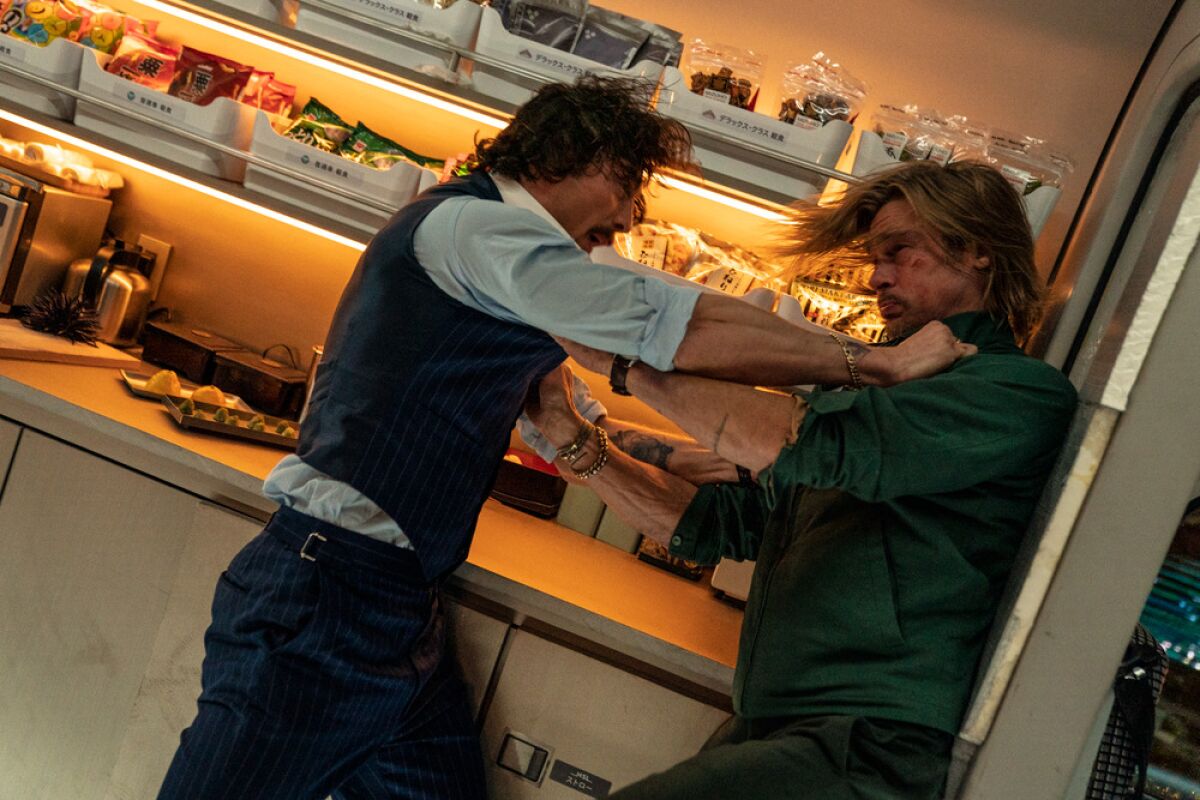Two men try brawling in a scene from the movie "Bullet Train."