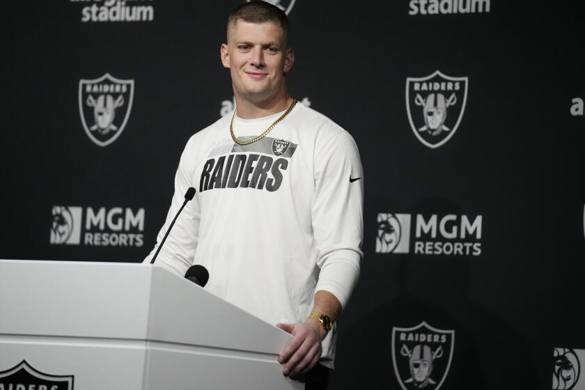 Las Vegas Raiders defensive end Carl Nassib (94) attends a news conference after an NFL football game against the Baltimore Ravens, Monday, Sept. 13, 2021, in Las Vegas. (AP Photo/Rick Scuteri)