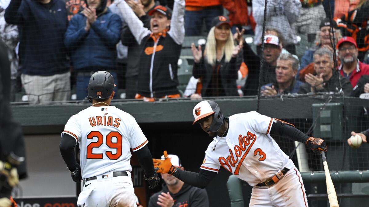 With bat and glove, Urías leads Orioles over Yankees 7-6