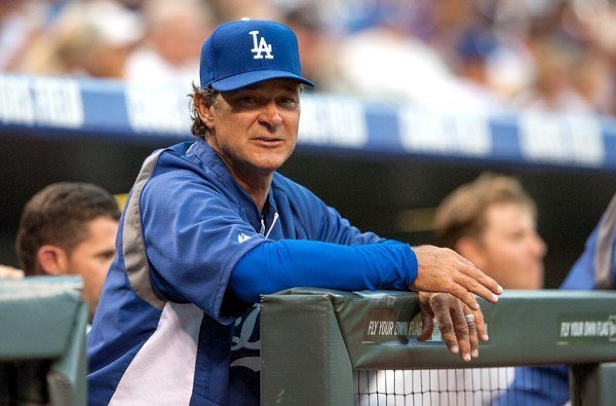 Manager Don Mattingly watches the Dodgers play the Rockies during a series in Denver last week.