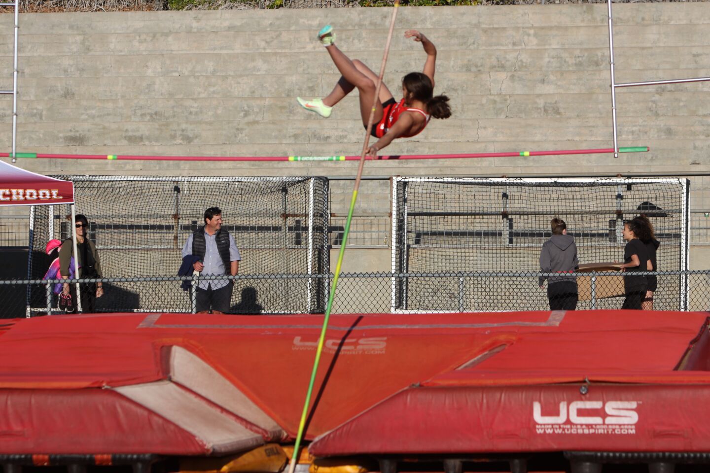 A La Jolla High School athlete clears the bar in the pole vault.