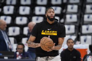 Los Angeles Lakers forward Anthony Davis (3) warms up before Game 2 of the NBA basketball Western Conference Final series Thursday, May 18, 2023, in Denver. (AP Photo/David Zalubowski)