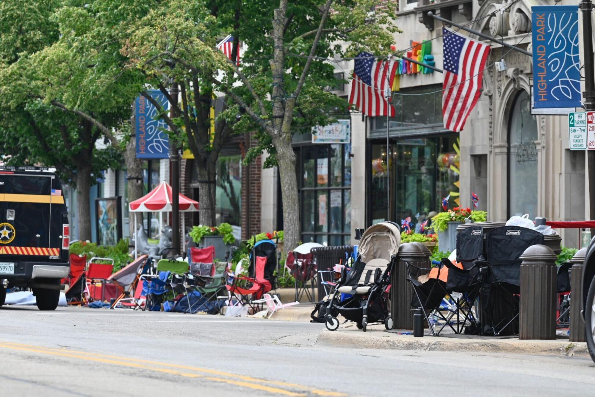 Chairs and empty strollers sit abandoned along the parade route.