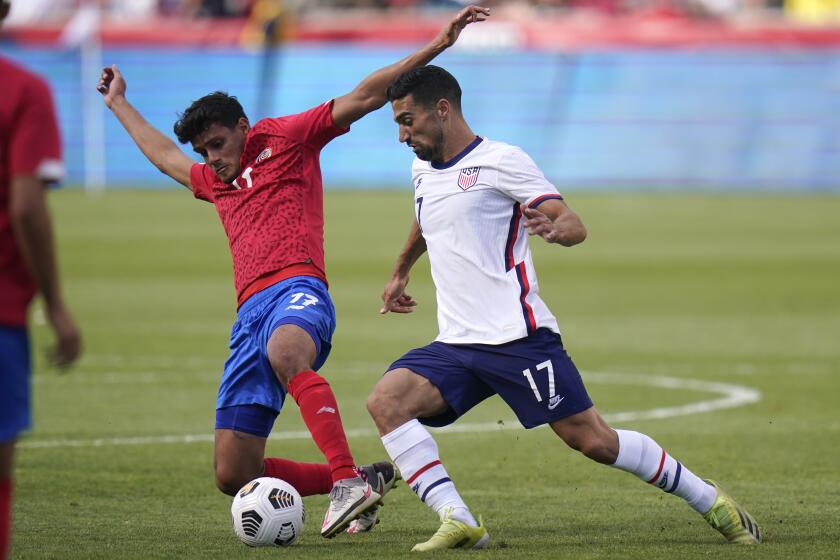 United States Sebastian Lletget, right. battles for the ball with Costa Rica's Yeltsin Tejeda, in the first half during an international friendly soccer match Wednesday, June 9, 2021, in Sandy, Utah. (AP Photo/Rick Bowmer)
