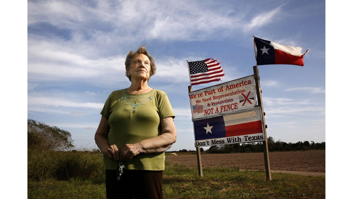 Pamela Taylor, 88, lives on the border where she and her children have put up a sign to say they don't want a fence.
