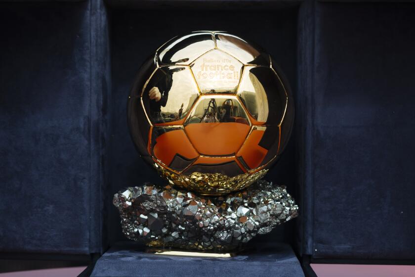 The Ballon d'Or award in Boulogne-Billancourt, outside Paris, Friday, July 17, 2020. The prestigious Ballon d’Or will not be awarded this year because the coronavirus pandemic has disrupted the soccer season. Awarded by France Football magazine, the Ballon d’Or has been given out every year since Stanley Matthews won the first one in 1956. Lionel Messi has won it a record six times — one more than longtime rival Cristiano Ronaldo. (AP Photo/Kamil Zihnioglu)
