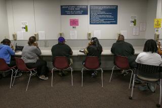 FILE - In this Sept. 20, 2013, file photo, visitors use the Unemployment Insurance phone bank at the California Employment Development Department, EDD office in Sacramento, Calif. The EDD office will not accept new unemployment claims for the next two weeks as the state works to prevent fraud and reduce a backlog as more than 2 million people are out of work statewide during the coronavirus pandemic, officials said late Saturday, Sept. 20, 2020. Nearly 600,000 Californians are part of a backlog where their unemployment claims have not been processed by the state's EDD for more than 21 days, the state said in a news release. (AP Photo/Rich Pedroncelli, File)